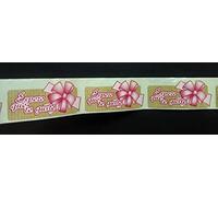 500 etiquetas ESPERO QUE TE GUSTE con lazo rosa. Tamaño 55x25 mm. Realizadas en papel blanco e impreas en cuatricomia. Simulando papel kraft regalo + lazo rosa