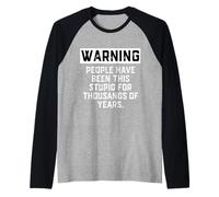 Advertencia Que la Gente ha Sido Tan estúpida Durante años Broma de Historia Camiseta Manga Raglan