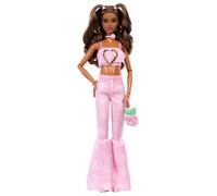 Barbie Deluxe Style Muñeca n.12 con Top Corto de Denim Rosa y Vaqueros Acampanados a Juego con Estampado de Rosas, Pelo castaño Ondulado y Accesorios como un Bolso y Joyas, JJN72