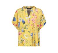 Blusa aire con estampado natural y botones en manga corta.