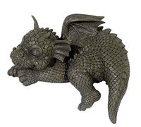 Borde de dragón de jardín con aspecto de sentadilla. ¡Jardín! ¡Figura! ¡Dragón!