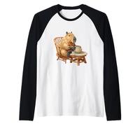 Capibara Divertida sentada para los Amantes de los Pasatiempos de Potter Camiseta Manga Raglan
