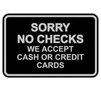 Cartel con texto en inglés "Sorry No Checks We Accept Cash or Credit Cards"