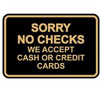 Cartel con texto en inglés "Sorry No Checks We Accept Cash or Credit Cards"
