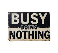 Cartel de metal de chapa con texto en inglés "Busy Doing Nothing"