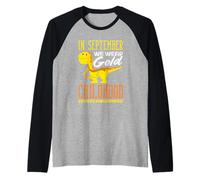 Concientización sobre el Dinosaurio Dorado de septiembre del cáncer Infantil Camiseta Manga Raglan