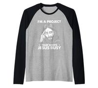 Cristiano religioso Soy un Proyecto Que Mantiene Ocupado a Jesús Camiseta Manga Raglan