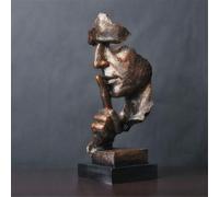 El silencio es una estatua creativa dorada, adornos sencillos de artesanía moderna.