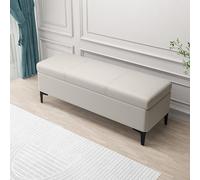 Elegante banco de almacenamiento de cuero con reposapiés oculto y juguete, perfecto para decoración de dormitorio y ahorro de espacio funcional al lado de la cama.
