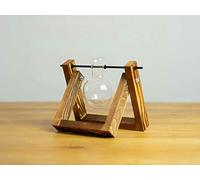 Elegante jarrón decorativo con forma de pistón redondo, marco de madera flameada con un émbolo de cristal transparente soplado artesanalmente.