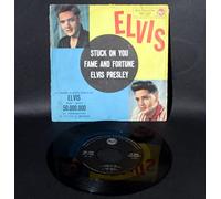 ELVIS PRESLEY - elvis 45 RPM fame and fortune / stuck on you