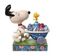 Enesco Jim Shore Peanuts Snoopy y Woodstock Figura de carretilla de Pascua, 5.75 pulgadas, multicolor