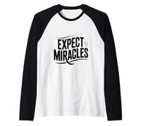 Espera Milagros con una Paloma pacífica Camiseta Manga Raglan