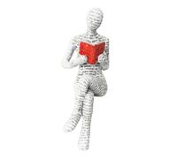 Estatua de una pensadora lectura, libros-escultura de un modernismo leyendo