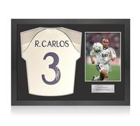 Exclusive Memorabilia Camiseta del Real Madrid 1999-00 firmada con el número por Roberto Carlos. Marco icónico.