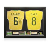 Exclusive Memorabilia Camisetas de Brasil firmadas por Roberto Carlos y Kaká. Enmarcadas.