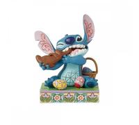 Figura enesco diseny stitch comiendo conejo de chocolate con huevos