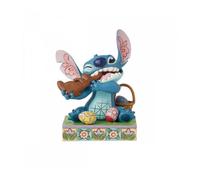 Figura enesco diseny stitch comiendo conejo de chocolate con huevos