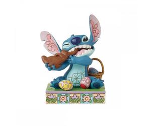 Figura enesco diseny stitch comiendo conejo de chocolate con huevos