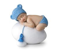 Figura niño bebé azul durmiendo sobre huevo,7,5x8cm.