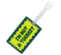Fisura - Identificador de maletas original “I’m not a tourist”. Tarjeta de identificación para equipaje verde. Etiqueta de equipaje de silicona para maleta o mochila. 10,5 cm x 6,5 cm