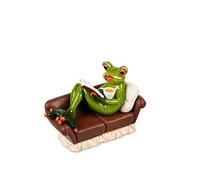 Formano Frosch Feierabend - Figura decorativa de mujer en sofá con libro y taza de café o chocolate