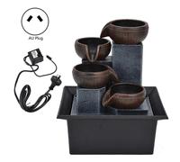 Fuente de agua de mesa con luz LED amarilla, ideal para la relajación según el Feng Shui. Decoración