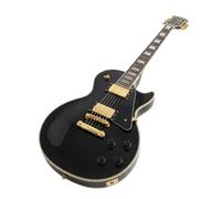 Guitarra eléctrica de un solo corte, color negro, 5 capas, ribetes dorados, mástil y cuerpo sólido.