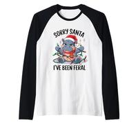 Hipopótamo navideño enredado en luces navideñas Camiseta Manga Raglan