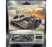 Hot Wheels F1 The Movie APXGP - Coche fundido a presión, negro con librea dorada, escala 1:64, jinetes reales, tres juegos de neumáticos con estante de almacenamiento