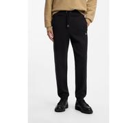 HUGO Pantalones de chándal de algodón con logo apilado - StyleDimacs, 50533695 Negro XL