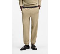 HUGO Pantalones de chándal en felpa de algodón con insignia de logo - StyleNevatro, 50564047 Beige XL