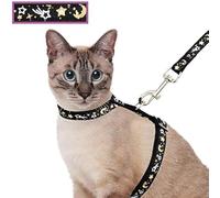 Juego de arnés y correa para gatos para caminar al aire libre, a prueba de escapes, correa de seguridad suave ajustable con diseño de estrella dorada y luna que brilla en la oscuridad, color negro
