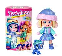 KOOKYLOOS Serie Holiday Yay! - Muñeca sorpresa coleccionable con accesorios de moda, ropa, zapatos y juguetes, con 3 expresiones divertidas
