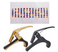 KXUSW Paquete de 2 cejillas para guitarra,cejilla guitarra, accesorios para guitarra,cejilla guitarra acustica, cejillas para casi todas las guitarras, negro/dorado,Una pegatina de escala de guitarra.