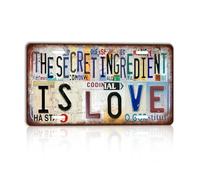Letrero de metal vintage con texto en inglés "The secret ingredient is love