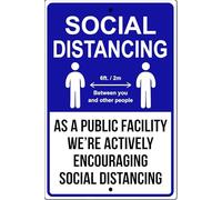 Letrero metálico que promueve el distanciamiento social y las medidas de seguridad.