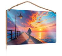 Letreros colgantes de pared con texto en inglés "A Person Walks Along A Wooden Pier As The Sun Sets, casting Warm Tones Across The Sky Wooded Sign Man Cave Decor Outdoor Patio Decor (23 x 35 cm)