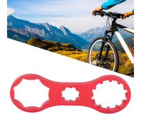 Llave de precisión para desmontar la horquilla delantera, ideal para reparaciones de bicicleta rápidas y eficientes.