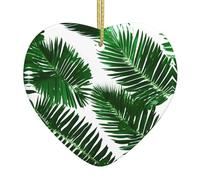 Los bonitos adornos de cerámica en forma de corazón con diseño de hojas de palma verdes son una opción ideal para decoraciones navideñas.
