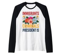Los inmigrantes no Son Criminales Cita de activismo Floral Camiseta Manga Raglan