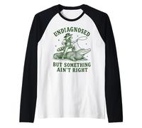 Mapache Divertido sin diagnosticar Pero Algo no está Bien Camiseta Manga Raglan