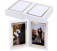 Meonua Juego de 25 carpetas y marcos de fotos de 4 x 6 pulgadas, cartón blanco, exhibición de doble cara con caballete vertical para mesa, decoración de pared, fiesta de boda, regalo de graduación o