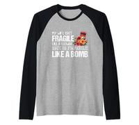 Mi Esposa no es frágil como una Flor Ella es como una Bomba Camiseta Manga Raglan
