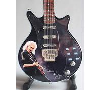 Mini guitarra de colección réplica de artistas de los años setenta.