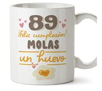MUGFFINS Tazas 89 Cumpleaños - En Español - Feliz Cumpleaños Molas un Huevo - 11 oz / 330 ml - Regalo original y divertido