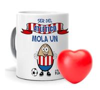 mundohuevo| Taza con frase “Ser del Atlético de Madrid mola un huevo”| Regalo original| Regalo de un pelota antiestrés con forma de corazón de color rojo| Taza de cerámica| Capacidad de 330ml.