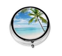 Palmera sobre paisaje marino del mar azul. Este pequeño pastillero redondo de tres compartimentos es perfecto para almacenar medicamentos diarios, vitaminas y sobre la marcha.