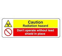 Panel de seguridad autoadhesivo "Fianza Radiación Hazard Don't Operate Without Lead Shield In Place" (150 mm x 50 mm) Distancia de visualización a menos de 3 m.