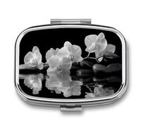 Pastillero de spa con 2 compartimentos para medicina, organizador de pastillas de viaje para bolso de bolsillo, diseño de flores blancas y negras sobre rocas negras